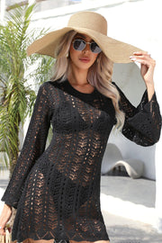 Black open-stitch crochet beach dress with bell sleeves and a round neckline.