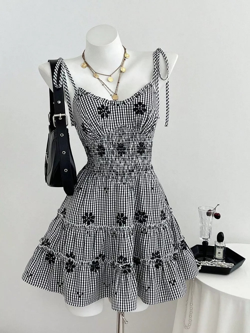 Gingham Floral Tiered Mini Dress in Black, front view
