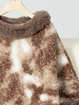 Faux fur trimmed camo poncho in Chocolate with a textured, fuzzy fabric and a soft collar detail.