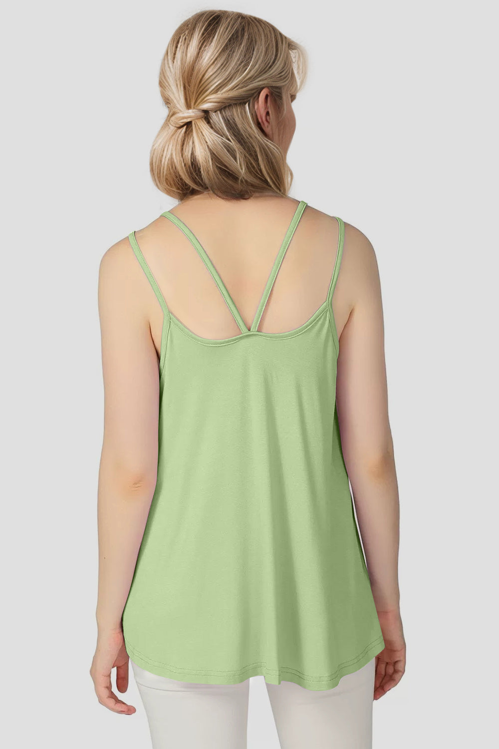 Double strap trapeze cami in light green with a V-back neckline.