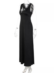 Black sleeveless maxi gown with lace trim neckline and cinched waist.