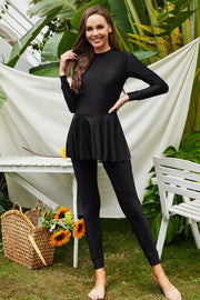 Black long sleeve swimsuit with flounce hem and full length leggings