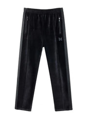 Black velour sweatpants with wide legs, side stripe, zip pockets, and butterfly emblem.