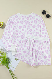 Pink leopard print loungewear set with long sleeve top and elastic waist shorts.