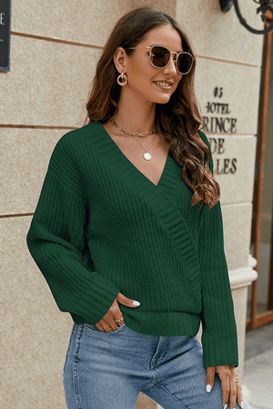 Dark green wrap knit v-neck pullover sweater with textured stitch detail and relaxed fit.
