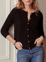 Black cashmere buttoned cardigan with a plunging neckline.