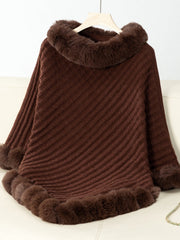 Chocolate knit poncho with faux fur trim at neckline and hem
