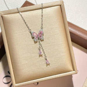 Sparkling butterfly pendant necklace with pink gems and delicate chain.