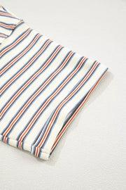 Striped cotton mini dress with pockets, featuring a cream base with red, blue, and brown vertical stripes.