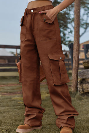 Brown utility cargo pants with wide legs and multiple pockets.