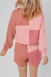 Colorblock loungewear set with patchwork design in dusty pink and light blue hues.