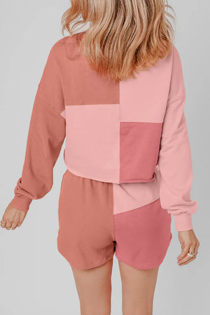 Colorblock loungewear set with patchwork design in dusty pink and light blue hues.