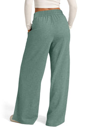Seamed palazzo lounge trousers in sage green with a relaxed fit and pockets.