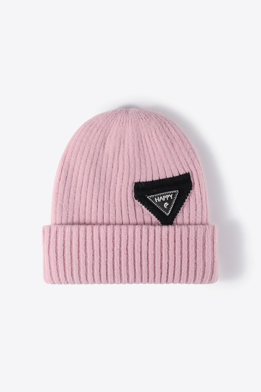 Pink ribbed acrylic beanie with a black triangle patch that says HAPPY