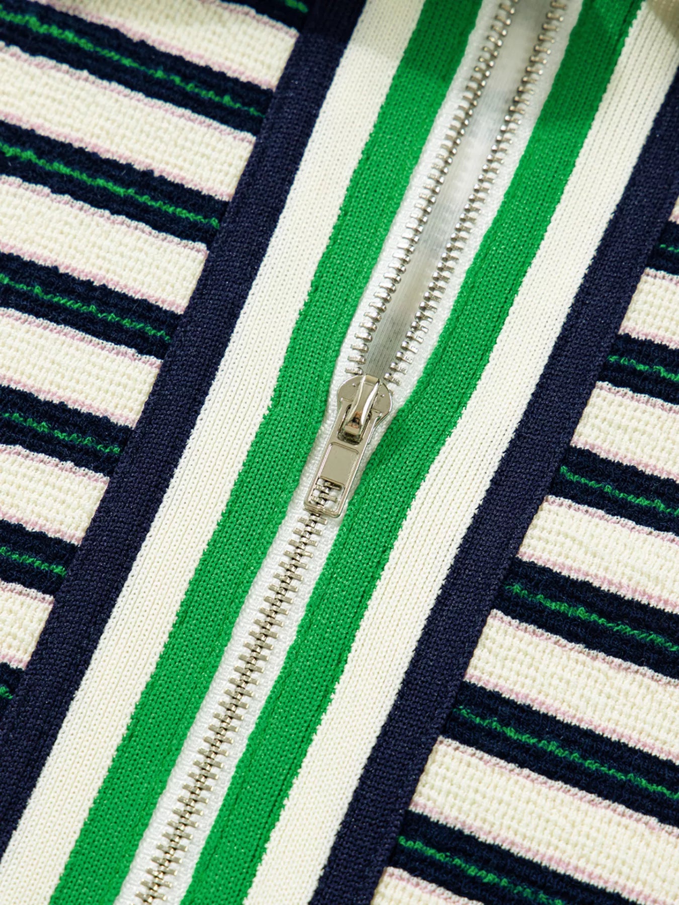 Zippered contrast collar striped knit top in navy with white, green, and navy stripes.