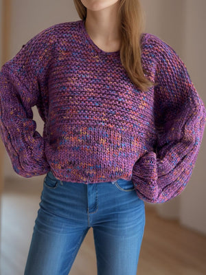Textured knit sweater in purple with multi-color flecks, featuring balloon sleeves and a V-neck.