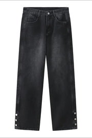 Dark wash baggy denim jeans with snap hem detail