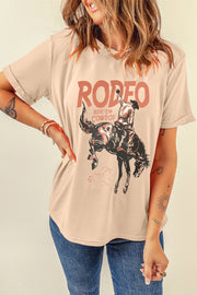Tan graphic t-shirt with a rodeo cowboy riding a bucking bronco and "RODEO RIDE 'EM COWBOY" text.