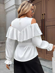 White ruffled cold shoulder maternity blouse with tie belt and bell sleeves.