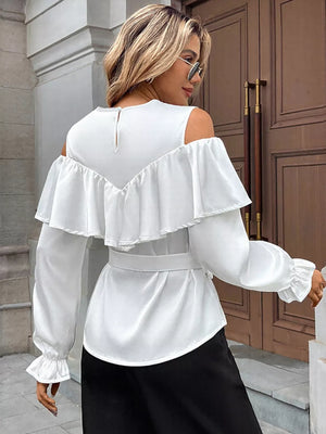 White ruffled cold shoulder maternity blouse with tie belt and bell sleeves.