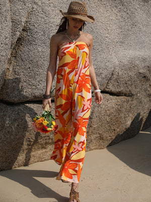 Floral print strapless jumpsuit in tangerine with tie back detail, wide leg, and beachy vibe.