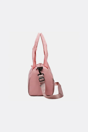 Dusty Pink duffel bag with adjustable strap and side zipper detail