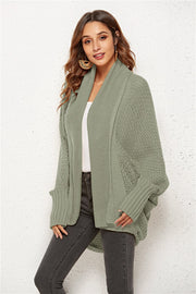 Sage knit cocoon cardigan with shawl collar and batwing sleeves.