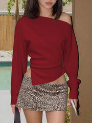 Red draped asymmetrical off-shoulder t-shirt with a unique side slit detail.