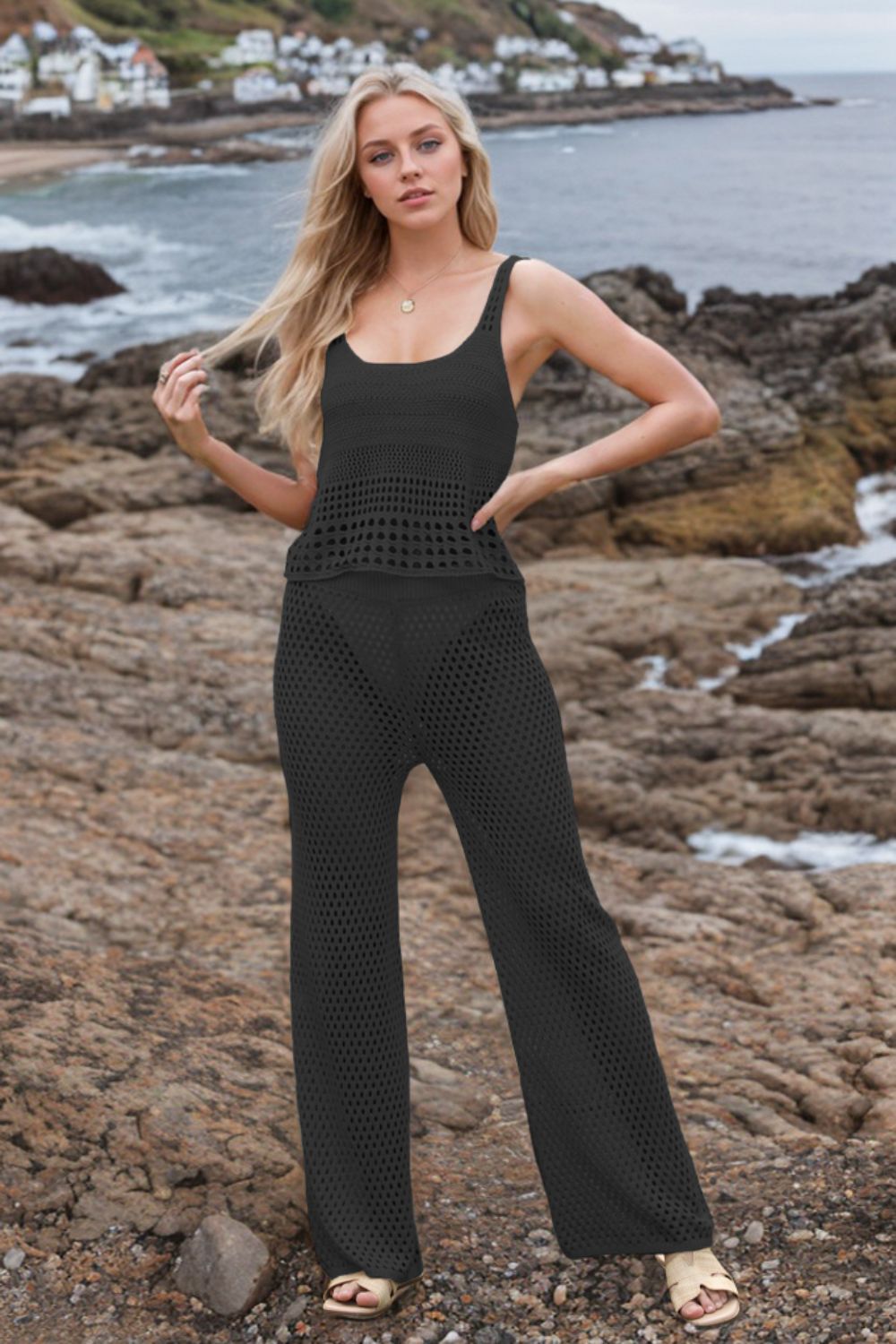 Black open-knit crochet tank top and wide-leg trousers set with scoop neck.