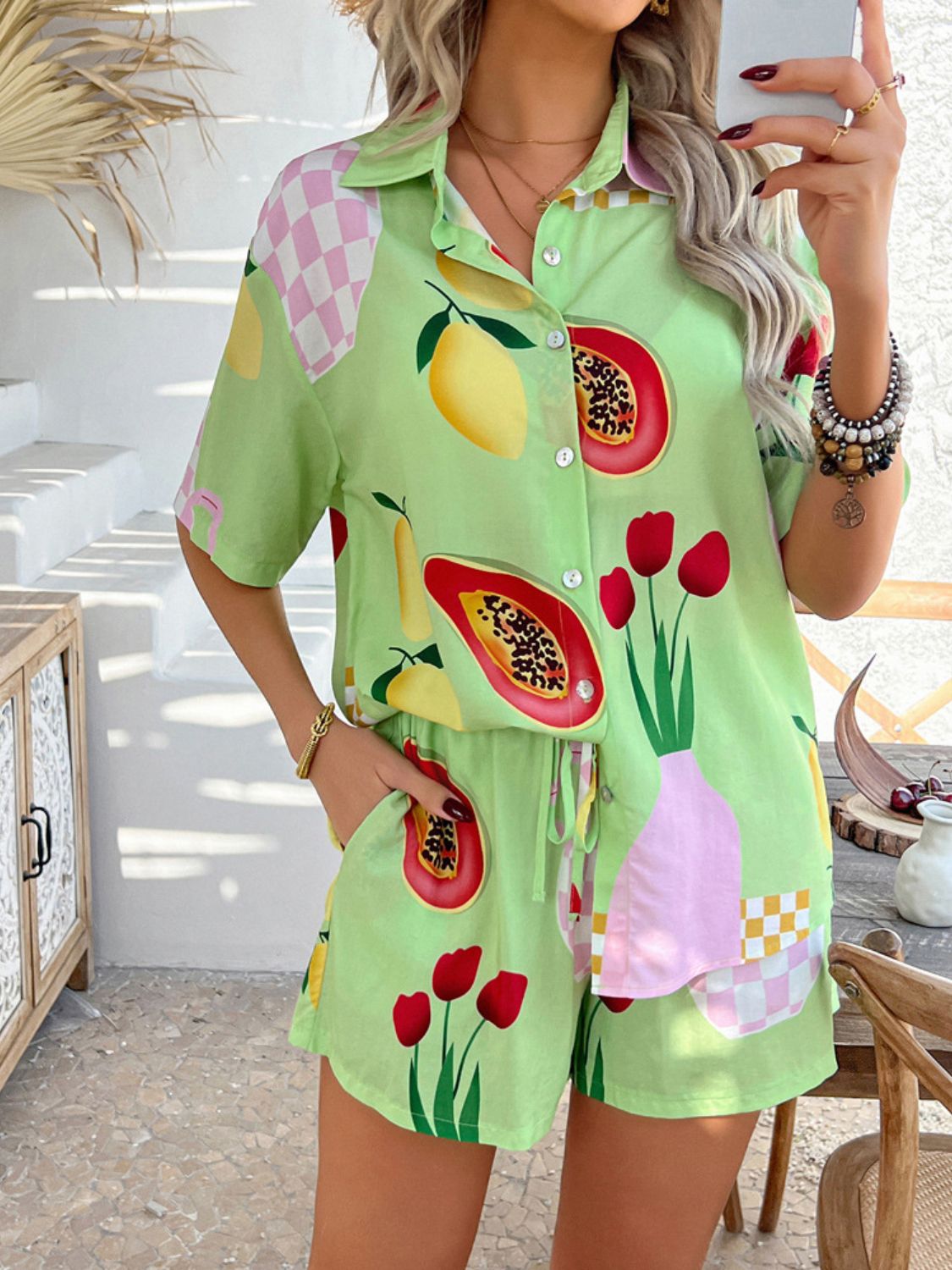 Lime green fruit and flower print button-up shirt and drawstring shorts set with checkered accents.