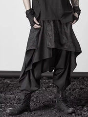 Black avant-garde layered harem sweatpants with asymmetrical design and dropped crotch.