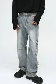 Medium wash wide leg cargo jeans with utility pockets and a relaxed fit.