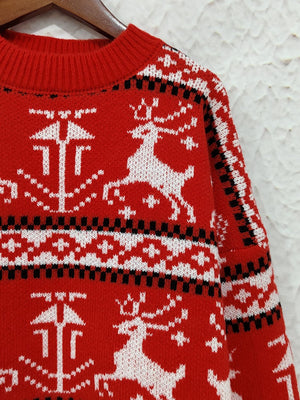 Red acrylic crew neck sweater with reindeer and fair isle pattern