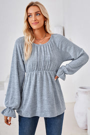 Light blue long sleeve blouse with gathered neckline and elastic waist