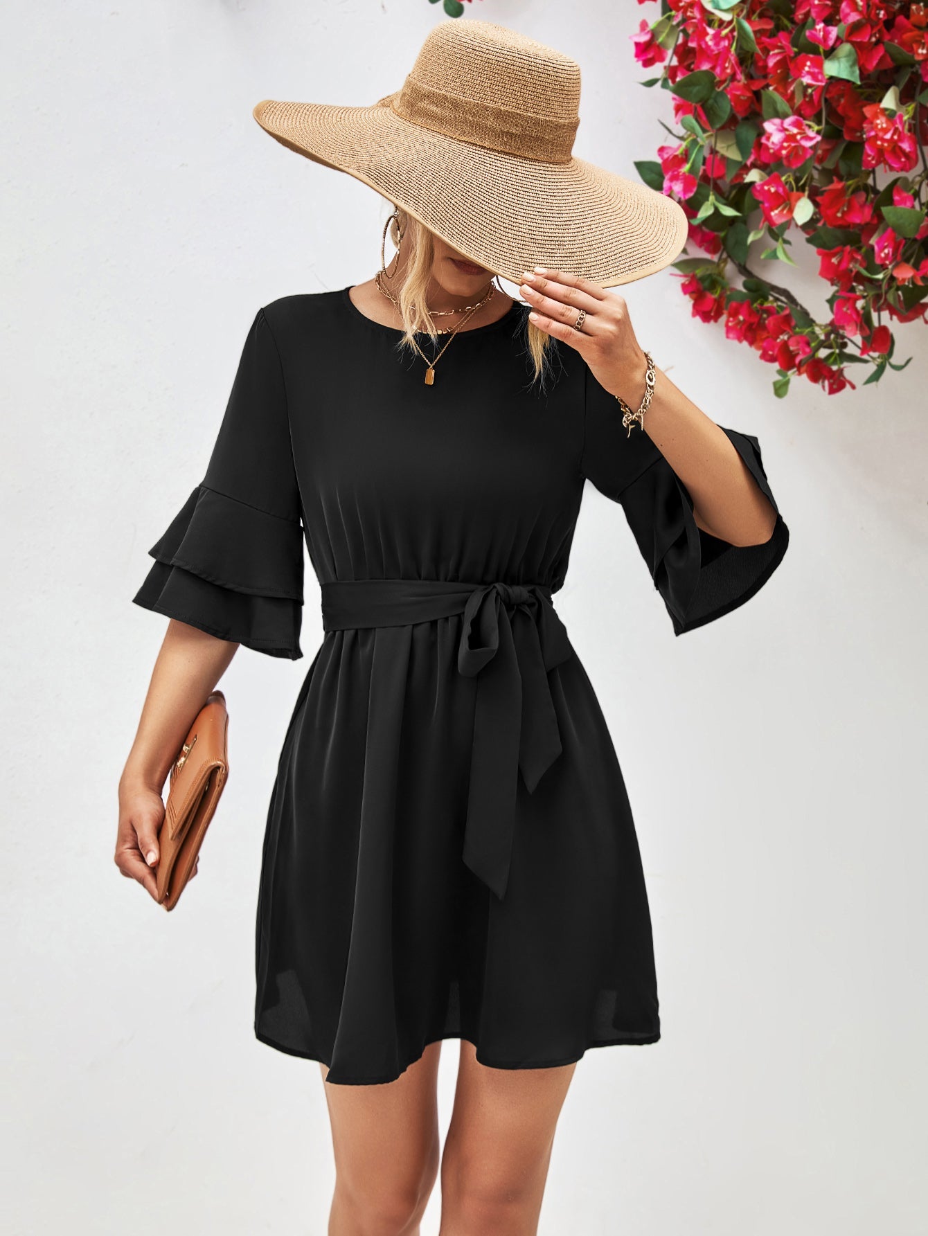Black tiered sleeve mini dress with tie waist and round neckline.
