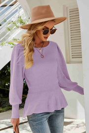 Lavender ribbed knit peplum top with puff sleeves and a round neckline.