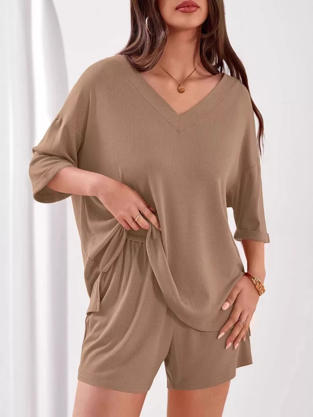 Khaki ribbed V-neck two-piece lounge set with relaxed fit top and drawstring shorts.