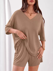 Khaki ribbed V-neck two-piece lounge set with relaxed fit top and drawstring shorts.