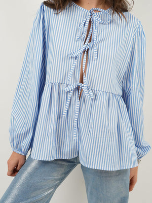Blue and white striped peplum blouse with voluminous sleeves and tie front detail