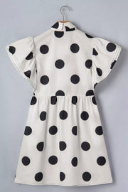 Black and white polka dot mini dress with ruffled sleeves and collared neckline.