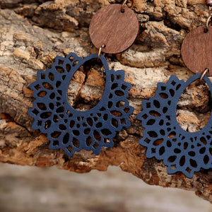Floral laser-cut wooden drop earrings in Dusty Blue with intricate cutouts and wood accent.