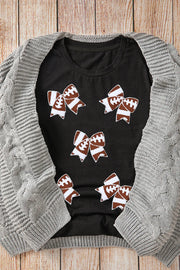 Black t-shirt with football bow graphic print, crew neck, short sleeves.