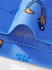 Blue toddler polo shirt with excavator print and textured fabric detail.