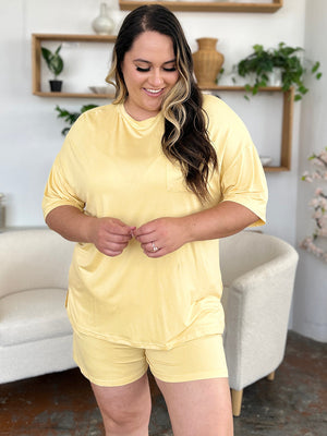 Yellow bamboo loungewear set with a relaxed fit tee and shorts, featuring a chest pocket.