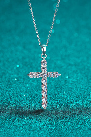 Silver pavé diamond cross pendant necklace with a delicate chain.