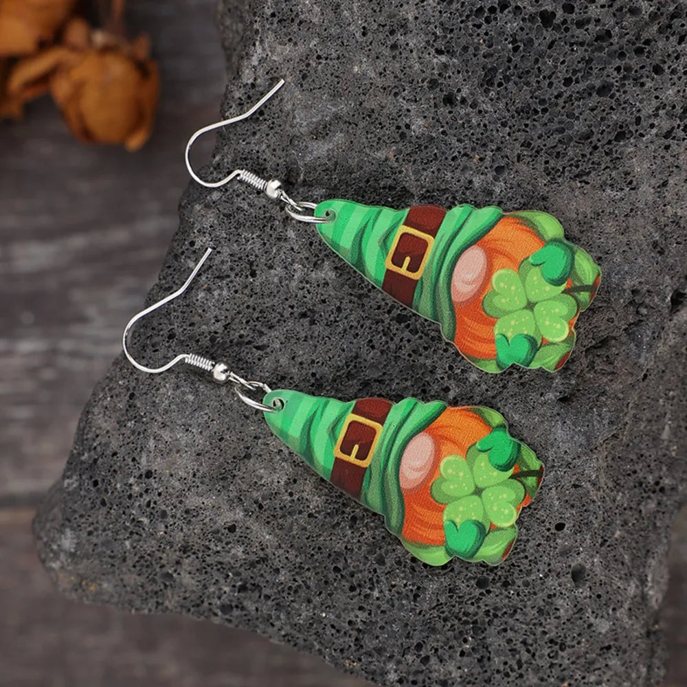 Leprechaun charm drop earrings in green, featuring a gnome with shamrocks and a buckle.