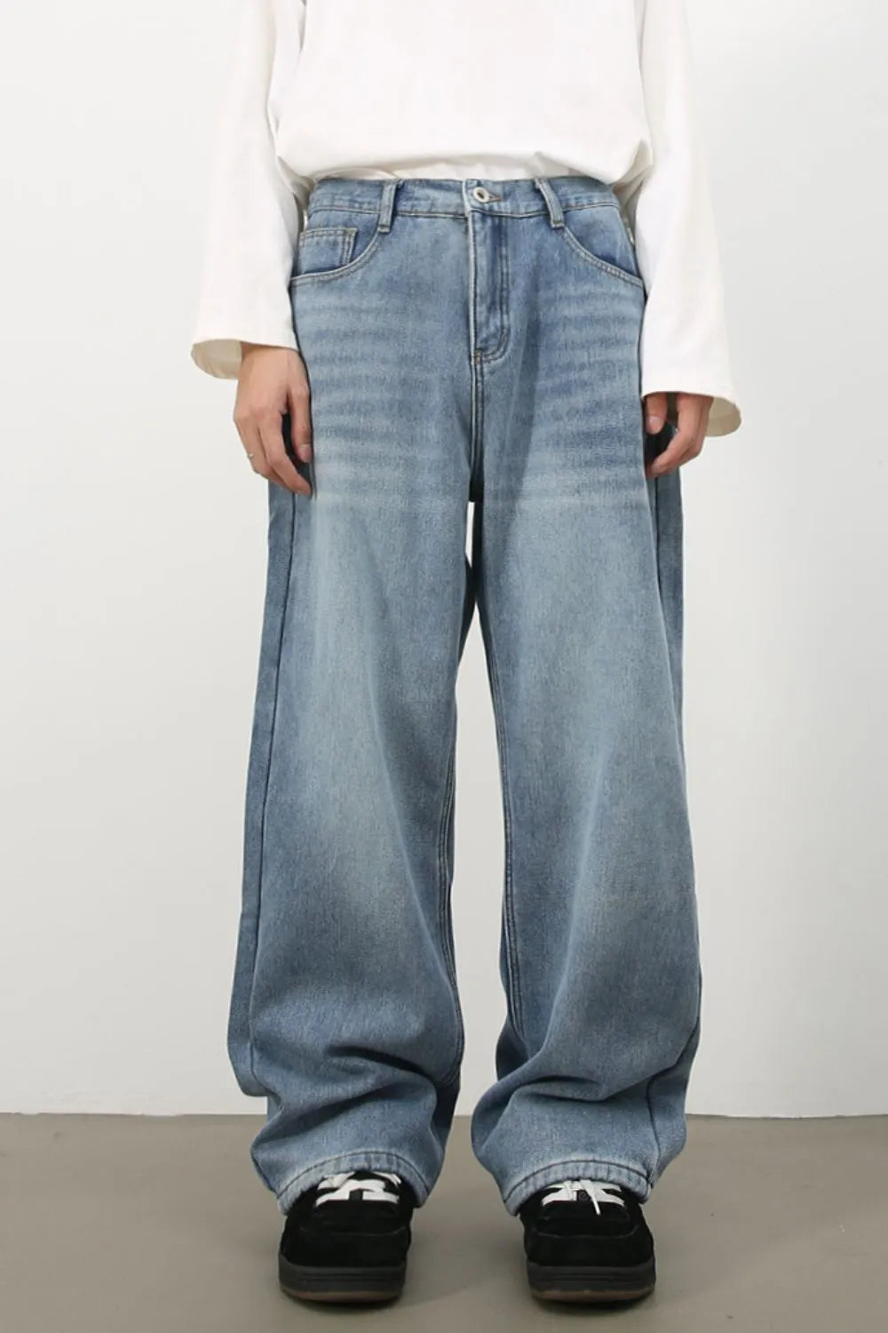 Oversized fade wash denim jeans in medium blue, wide leg, casual fit