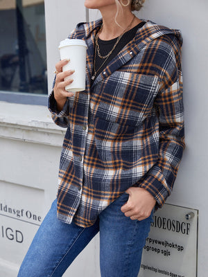 Plaid hooded shacket in navy and brown with button front and relaxed fit.