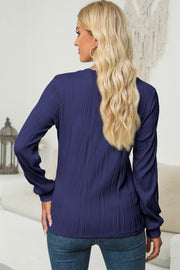 Navy textured wave crewneck pullover with long sleeves.
