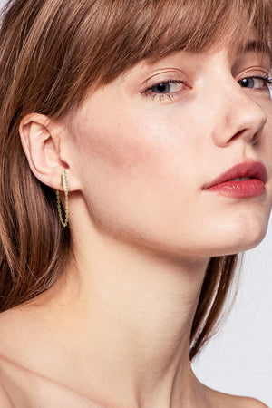 Gold chain cascade bar earrings with a delicate chain detail.